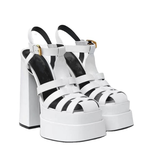 White strappy platform sandals with thick block heels and ankle buckles by Ancient Energy