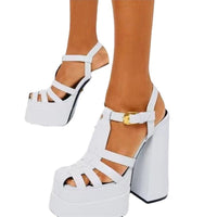White platform sandals with a thick block heel, strappy upper and ankle buckle