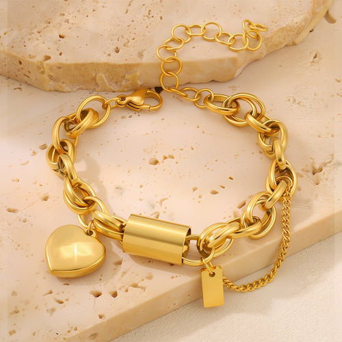 Versatile Titanium Bracelet With A Heart-shaped Pendant in gold-tone metal, with chunky linked chain and clasp.