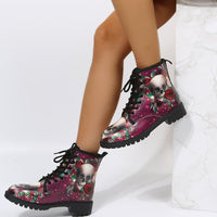 Women's high-top work boots with large skull-and-rose print on purple background, black laces