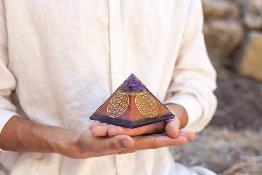 Authentic Flower of Life Copper Orgone Pyramid with Amethyst from Ancient Energy, featuring intricate design and polished copper surface.