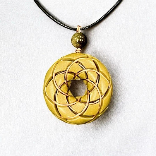 Brass and Libyan Desert Glass Torus Vortex Pendant necklace with Rodin Coil, crafted by Ancient Energy, featuring orgonite elements.