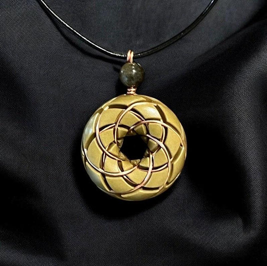 Brass Torus Vortex Pendant with Libyan Desert Glass orgonite necklace featuring Rodin coil design by Ancient Energy.