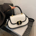 Premium retro matte tote bag with black trim and gold hardware, cream body, top handle.