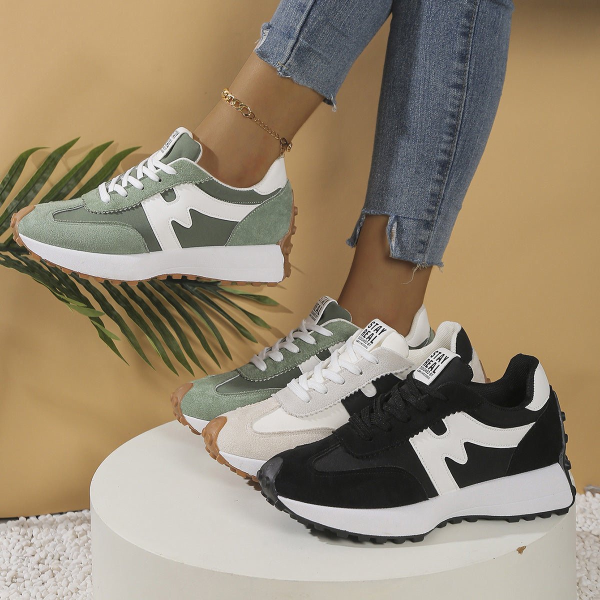 Womens chunky-soled lace-up sneakers; 3 colorways shown: green, beige, black with white soles.