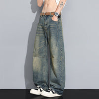 Men's straight-leg denim jeans in washed blue with faded panels.
