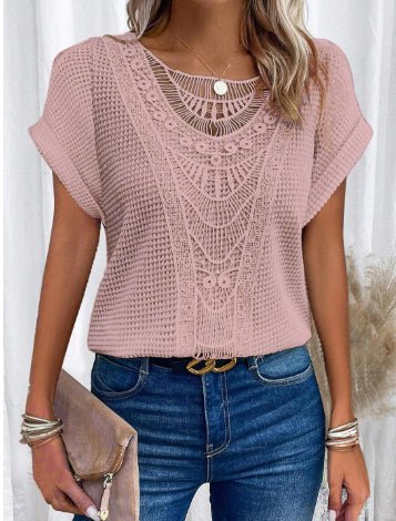 Pink hollow-out knit top with intricate lace neckline and short sleeves