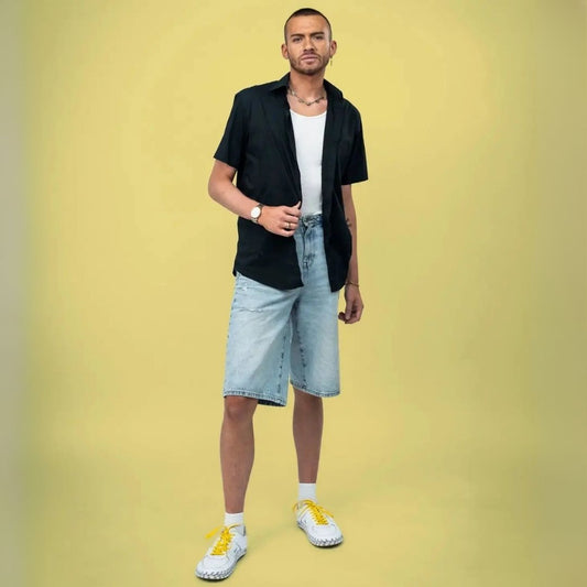 Yellow elastic shoelace by Bread, designed for easy slip-on footwear, with a bright, vibrant color and flexible stretch.