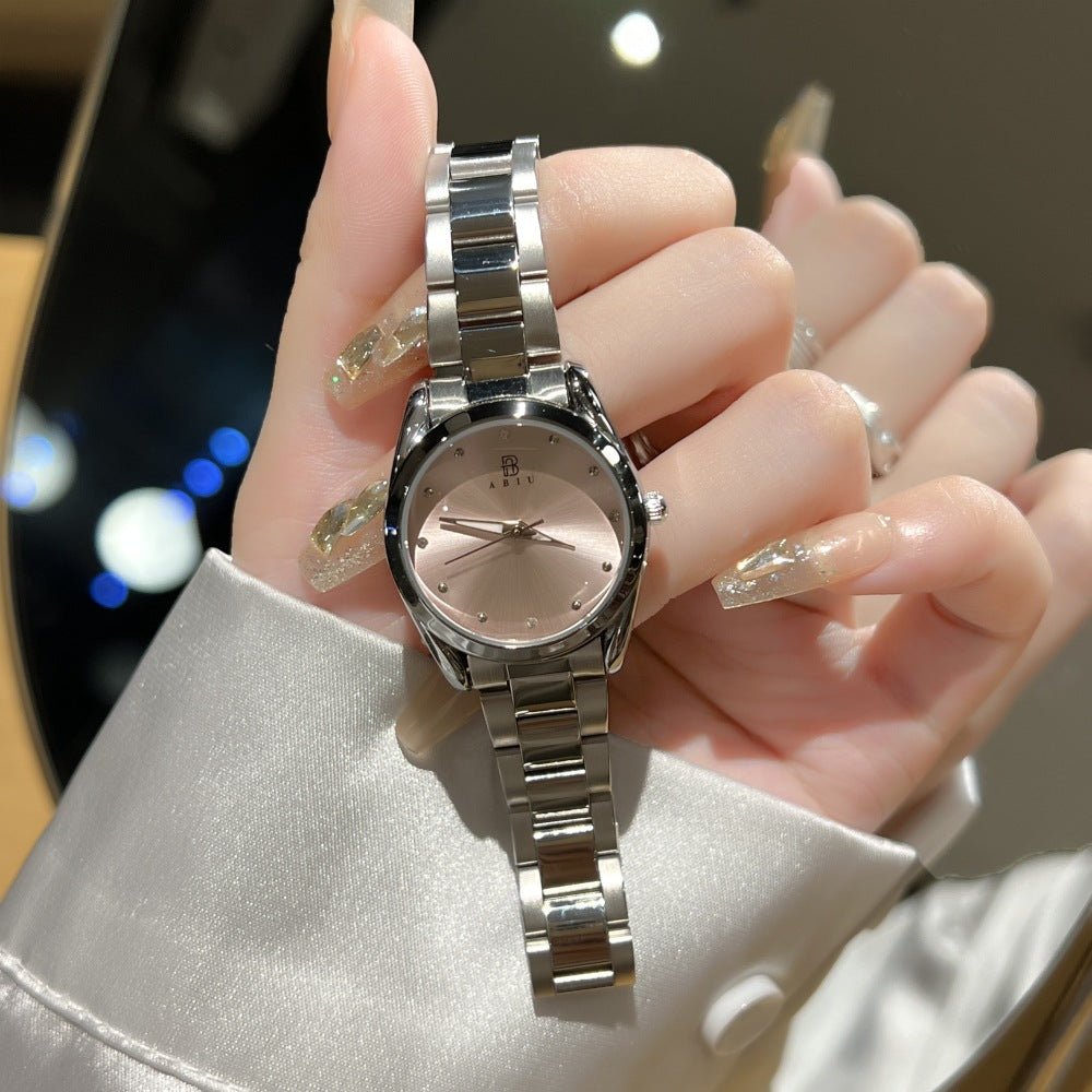 Exquisite ladies steel-band wristwatch with a rose-gold dial and silver bracelet.