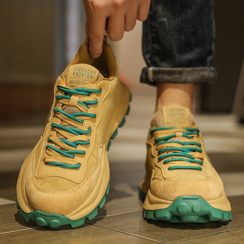 Pair of versatile casual dad shoes: beige Converse-style sneakers with teal laces and green outsoles