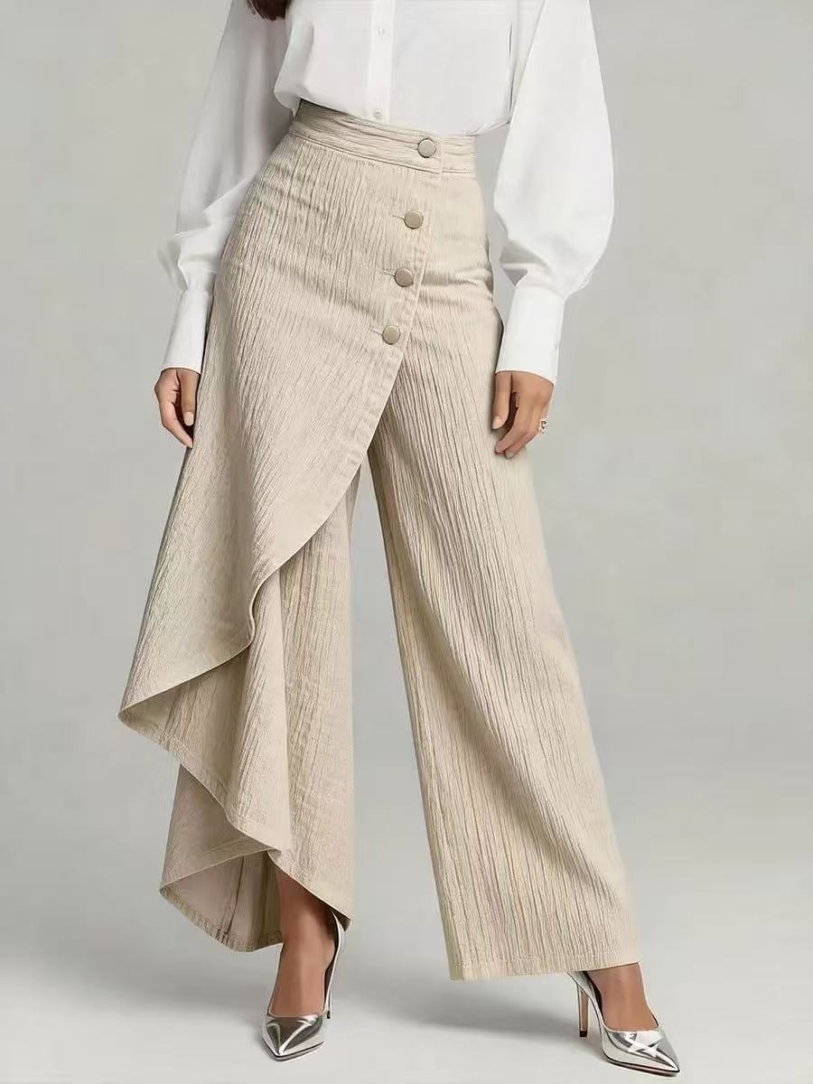Ancient Energy beige textured straight-leg pants with front button row and draped asymmetric wrap overlay