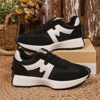 Womens chunky-soled lace-up sneakers, black and white, casual athletic shoes by Ancient Energy.