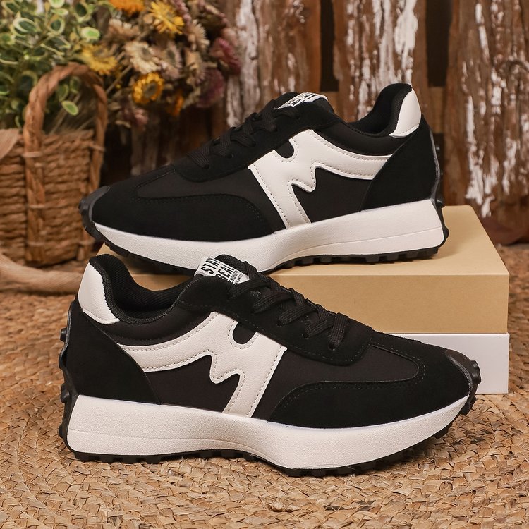 Womens chunky-soled lace-up sneakers, black and white, casual athletic shoes by Ancient Energy.