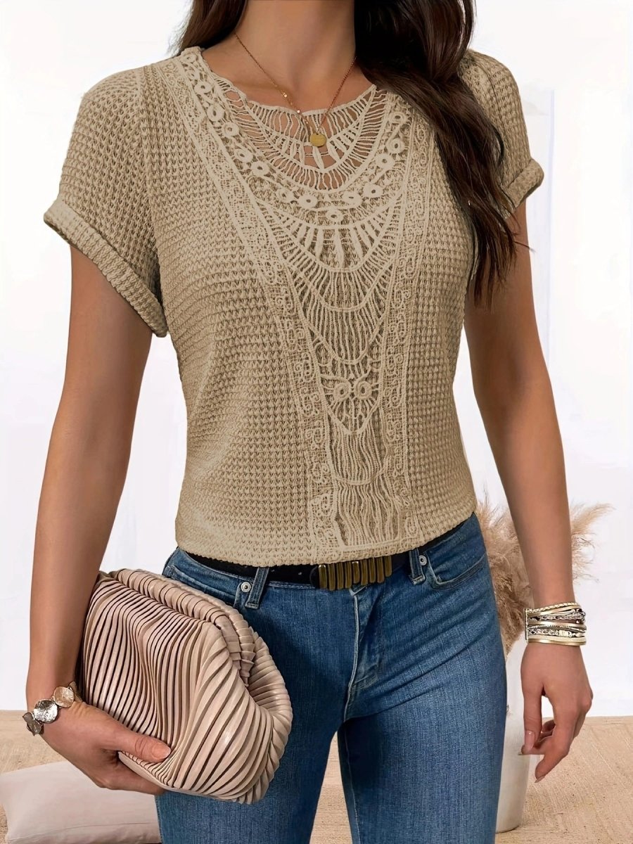 Beige summer hollow-out short-sleeve knit top with lace neckline; worn with blue jeans and a pleated beige clutch