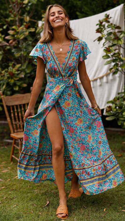 Mandotos International Tropical Bloom Maxi Dress with vibrant floral pattern and flowing fabric, perfect for summer events.