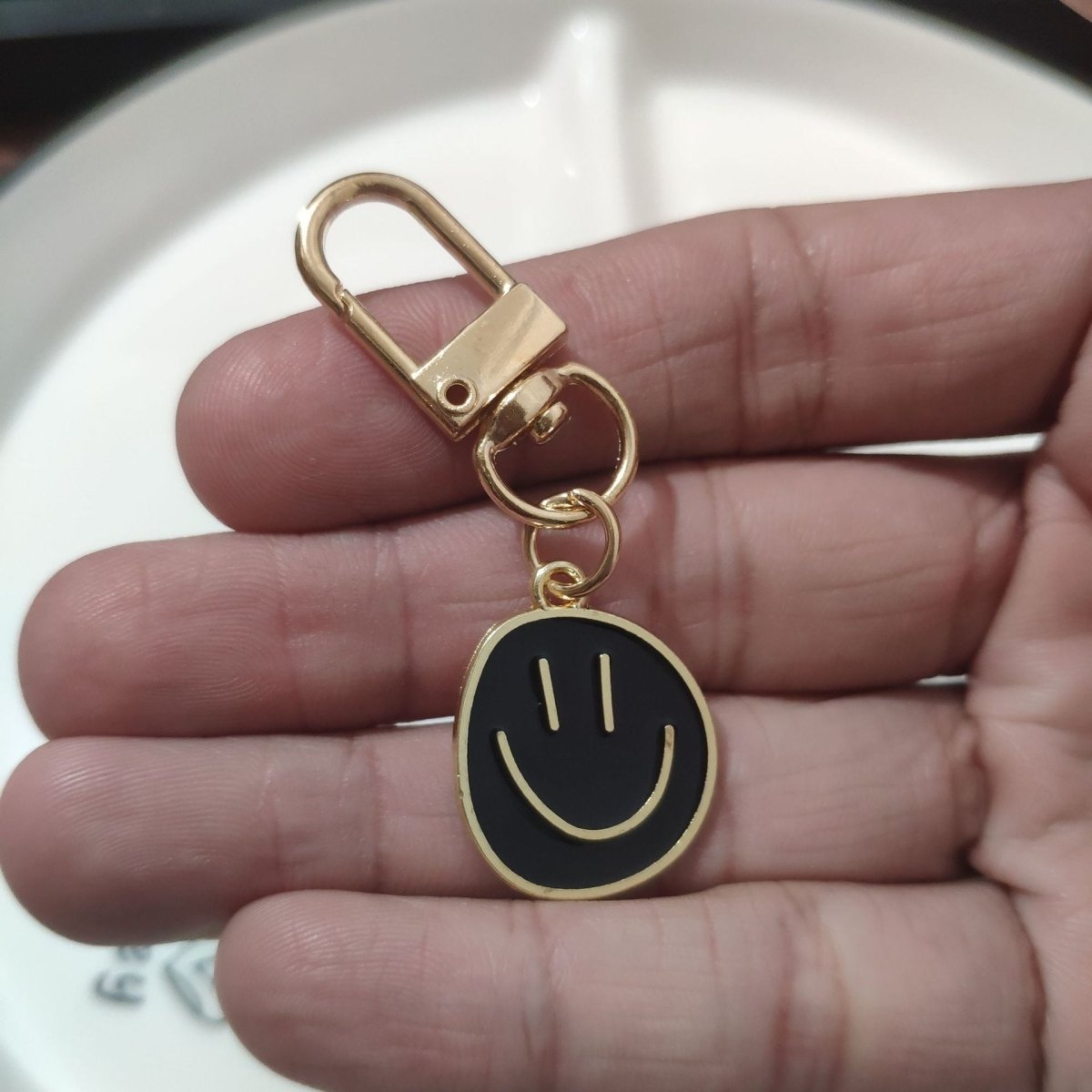 Cross-border e-commerce alloy color dripping smiley face keychain electroplated gold irregular expression bag pendant accessories - MANDOTOS INTERNATIONAL