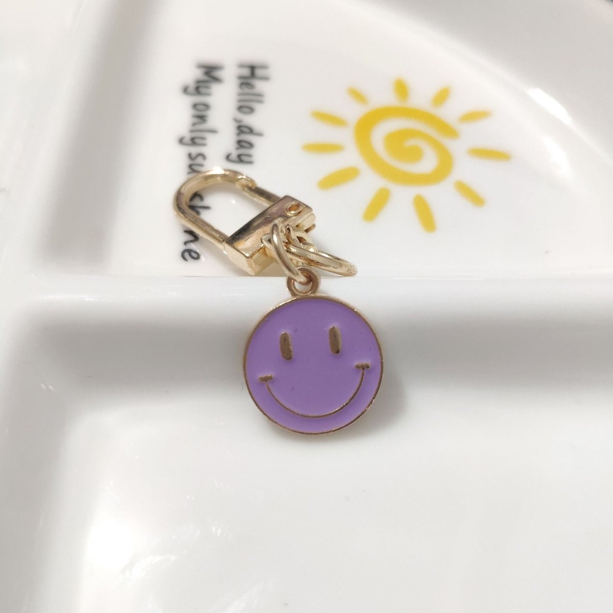 Cross-border e-commerce alloy color dripping smiley face keychain electroplated gold irregular expression bag pendant accessories - MANDOTOS INTERNATIONAL
