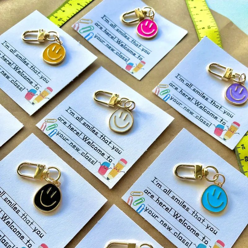 Cross-border e-commerce alloy color dripping smiley face keychain electroplated gold irregular expression bag pendant accessories - MANDOTOS INTERNATIONAL
