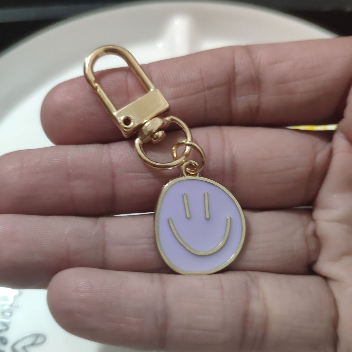 Cross-border e-commerce alloy color dripping smiley face keychain electroplated gold irregular expression bag pendant accessories - MANDOTOS INTERNATIONAL