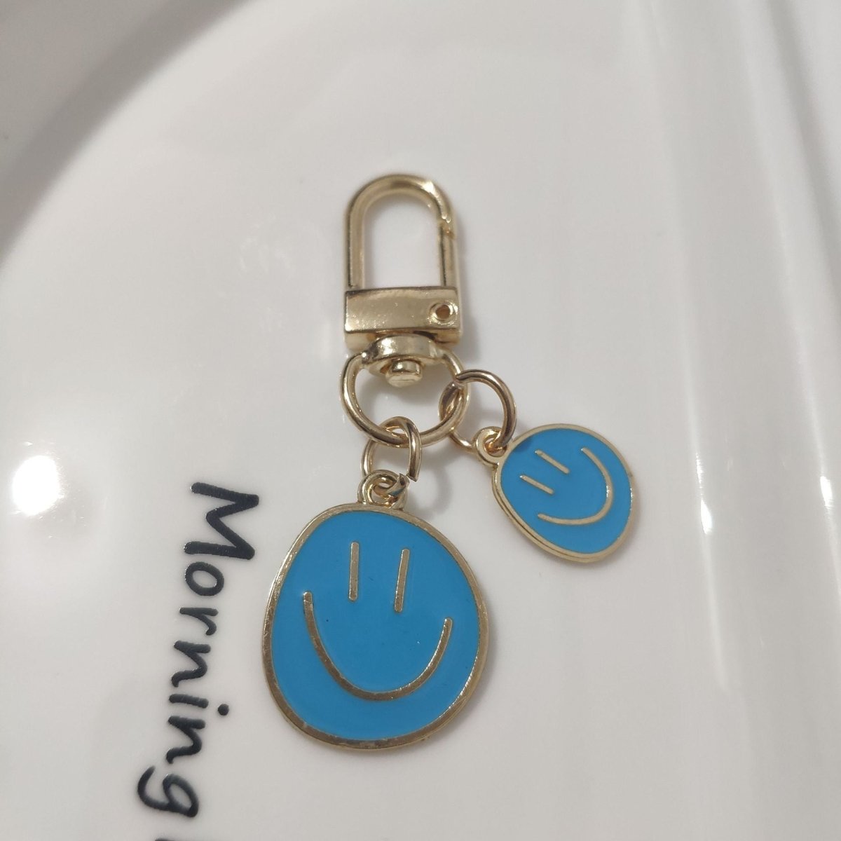Cross-border e-commerce alloy color dripping smiley face keychain electroplated gold irregular expression bag pendant accessories - MANDOTOS INTERNATIONAL