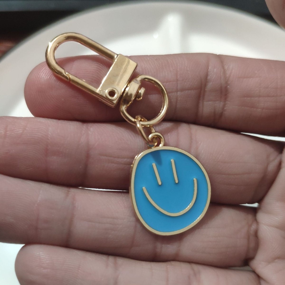 Cross-border e-commerce alloy color dripping smiley face keychain electroplated gold irregular expression bag pendant accessories - MANDOTOS INTERNATIONAL