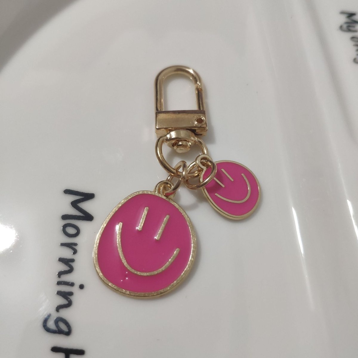 Cross-border e-commerce alloy color dripping smiley face keychain electroplated gold irregular expression bag pendant accessories - MANDOTOS INTERNATIONAL