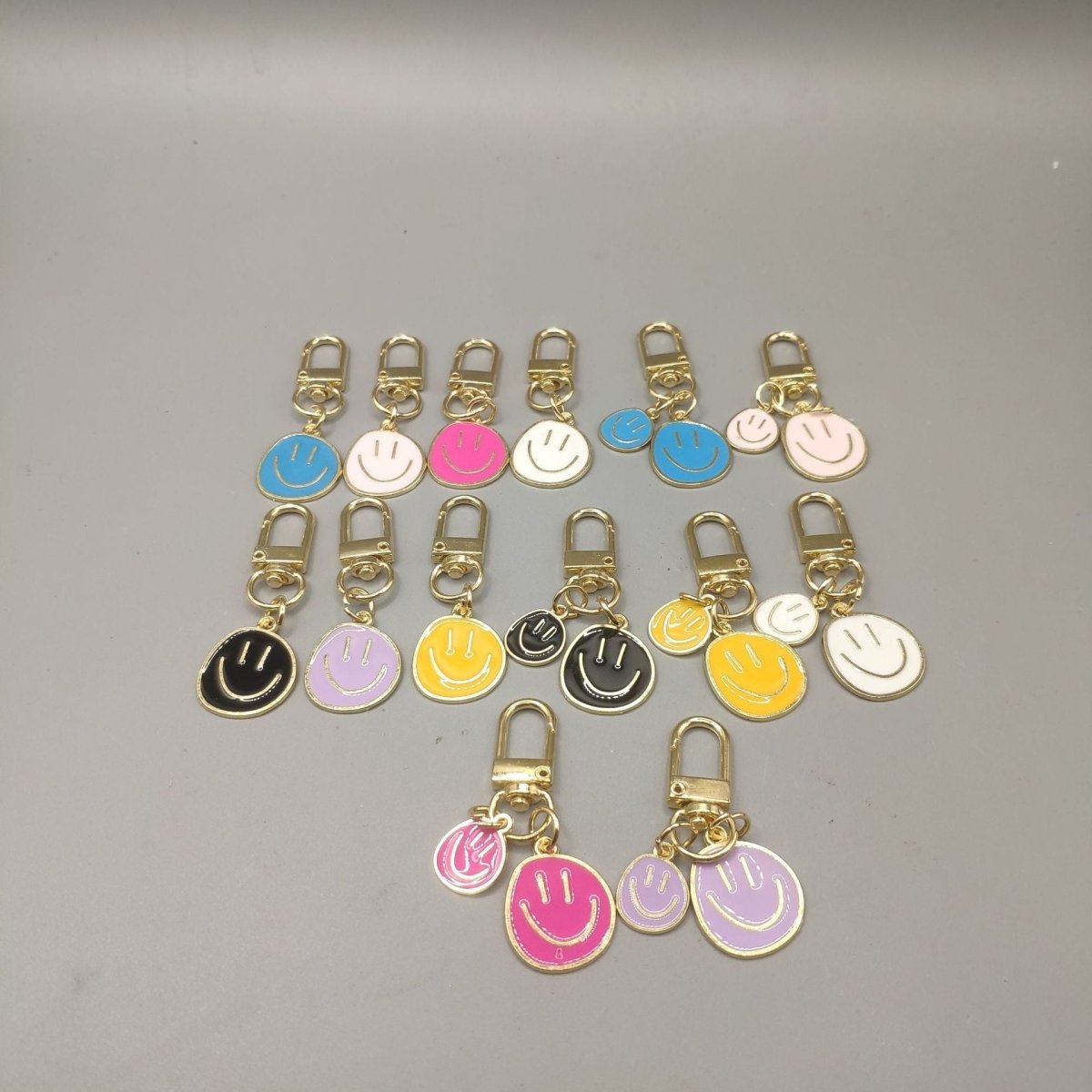 Cross-border e-commerce alloy color dripping smiley face keychain electroplated gold irregular expression bag pendant accessories - MANDOTOS INTERNATIONAL