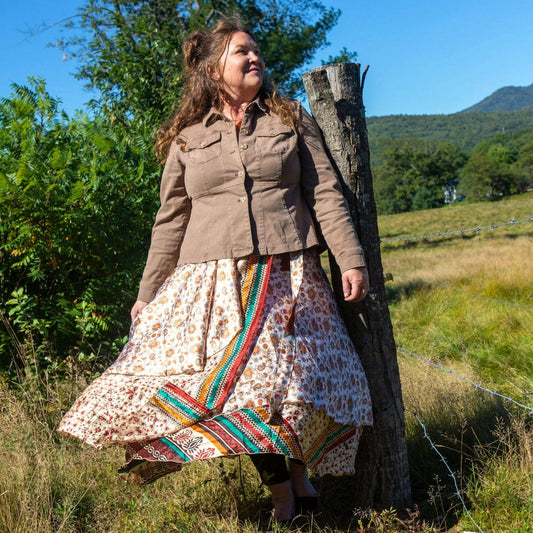 Darn Good Yarn The Original Sari Wrap Skirt in warm tones, flowing maxi style, worn as a versatile clothing and accessories piece.