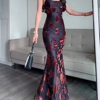 Flocked Strappy Maxi Dress by Ancient Energy, black with red floral flocking, floor-length.