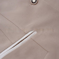 Professional beige blazer with white piping pocket and crest-button detail, Ancient Energy.