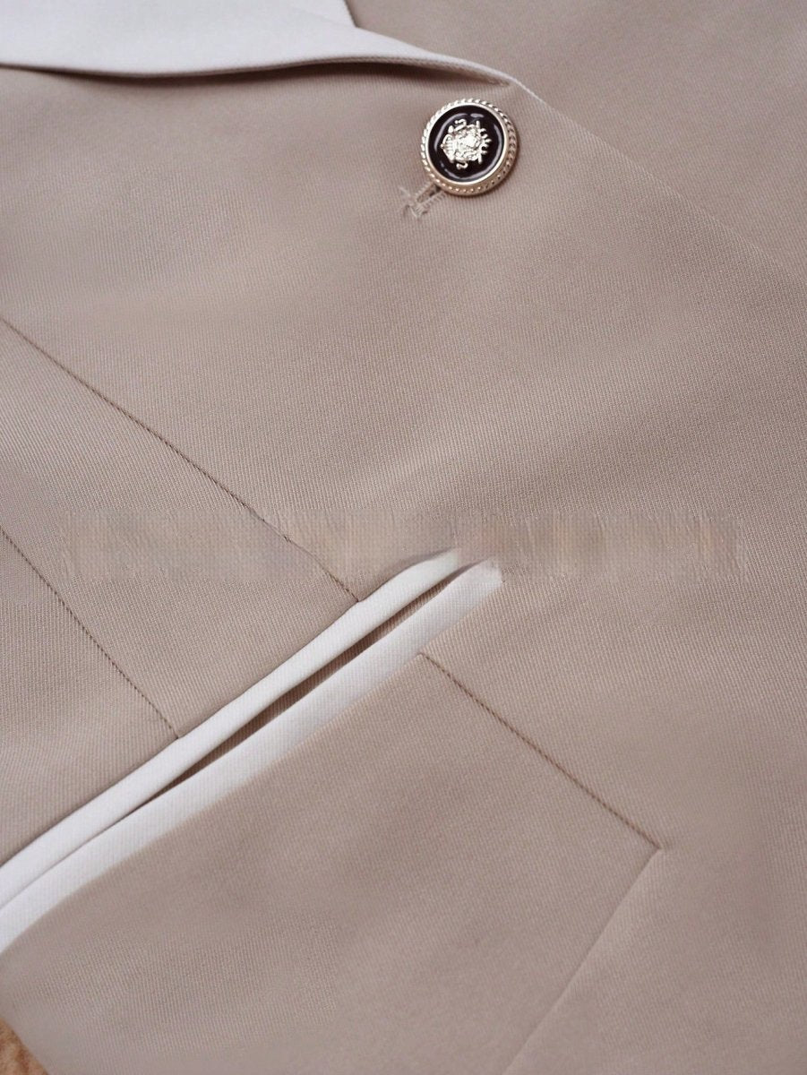 Professional beige blazer with white piping pocket and crest-button detail, Ancient Energy.