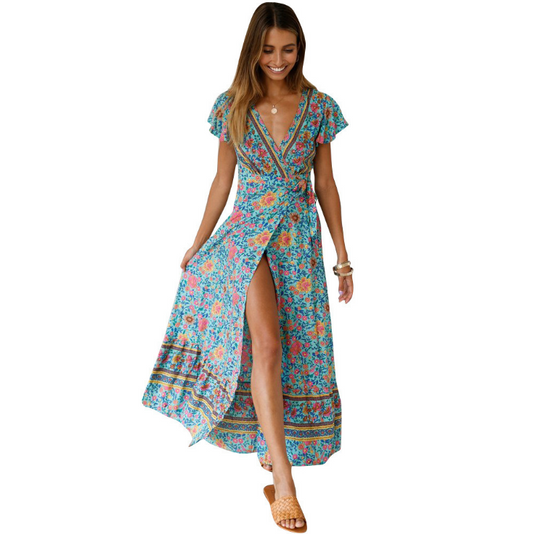 Mandotos International Tropical Bloom Maxi Dress featuring vibrant floral print, flowing fabric, and sleeveless design.