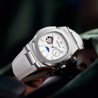 Mechanical watch with sun, moon and stars dial; silver case, white leather strap, Ancient Energy.