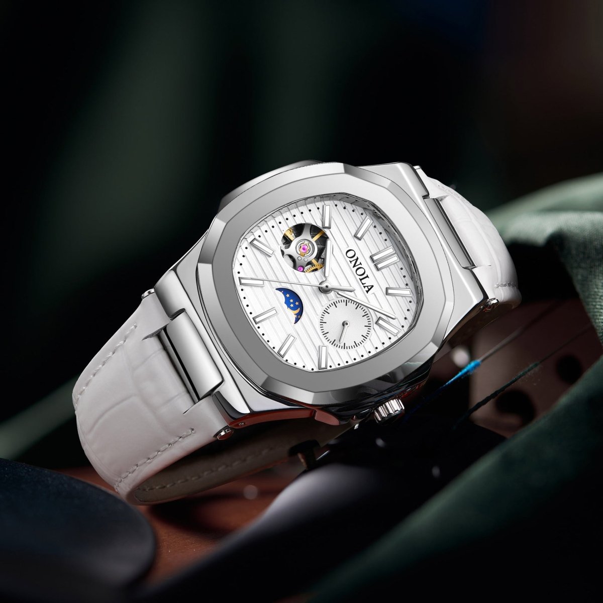 Mechanical watch with sun, moon and stars dial; silver case, white leather strap, Ancient Energy.