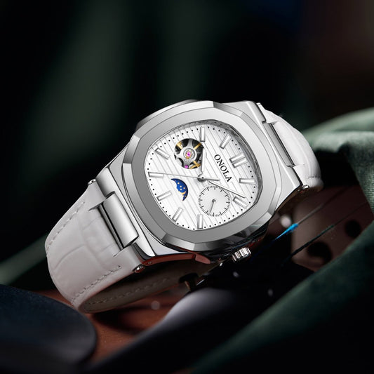 Mechanical watch with sun, moon and stars dial; silver case, white leather strap, Ancient Energy.
