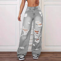 Trendy washed ripped straight jeans for women, grey distressed denim with multiple knee and thigh tears.