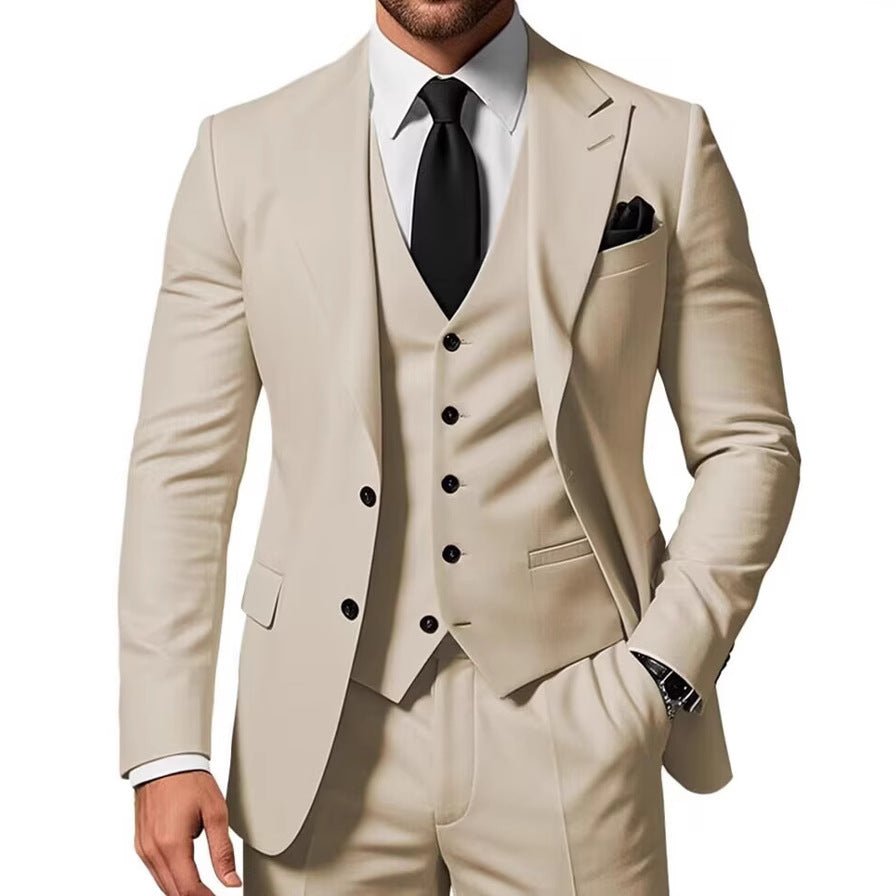 Beige men's three-piece suit with waistcoat and pants by Ancient Energy, white shirt, black tie.