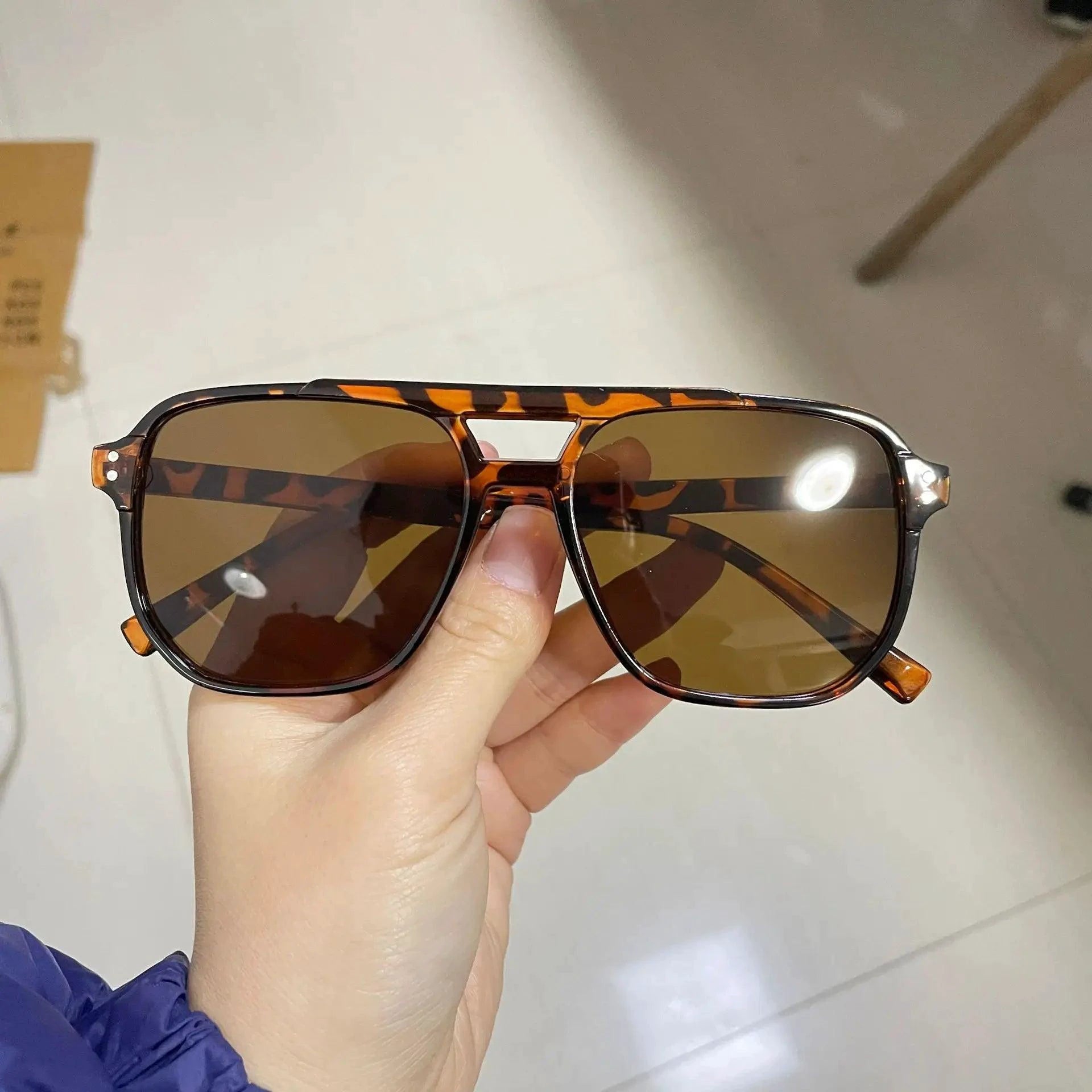 Vintage unisex square sunglasses with black lenses, designer style, UV400 protection, suitable for men and women.