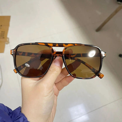 Vintage unisex square sunglasses with black lenses, designer style, UV400 protection, suitable for men and women.