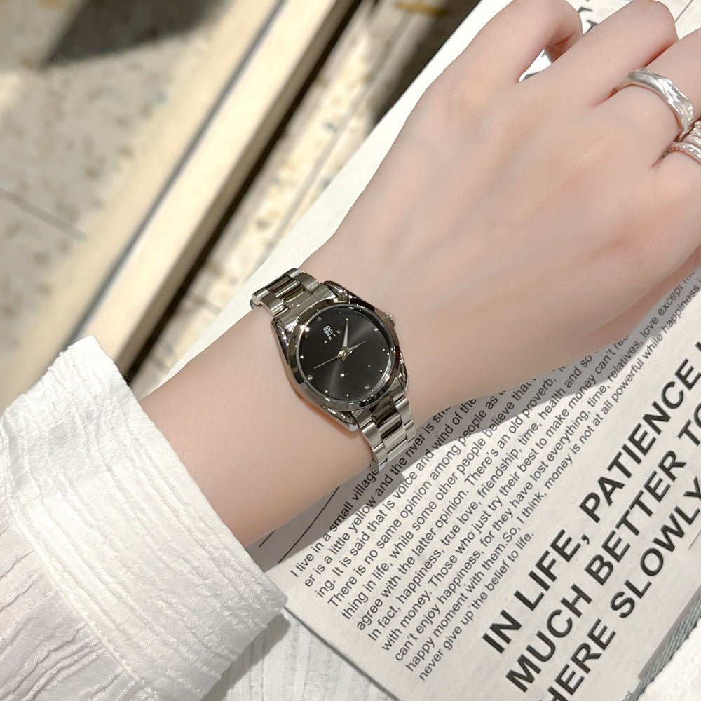 Exquisite Ladies Steel-band Wristwatch with silver stainless-steel band and black dial.