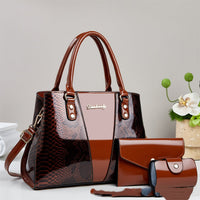 Large-capacity shouldercrossbody bag with brown snakeskin pattern; set of 3 including tote bag, matching wallet, and cylindrical purse.