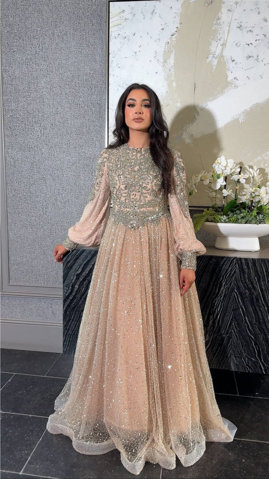 Iyza Belaar Bashira long sleeve embellished sequin modest ball gown with intricate detailing and elegant design.