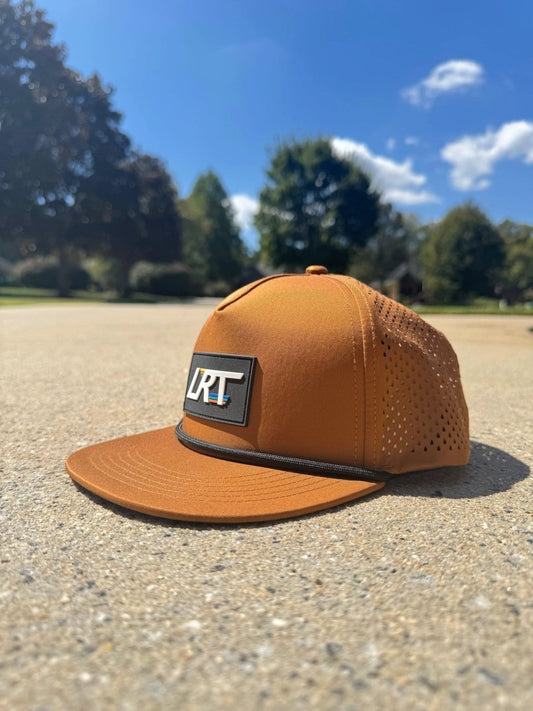 Little Rad Things waterproof age snapback hat in chestnut, showing a close-up of the brown, durable hat with adjustable strap.