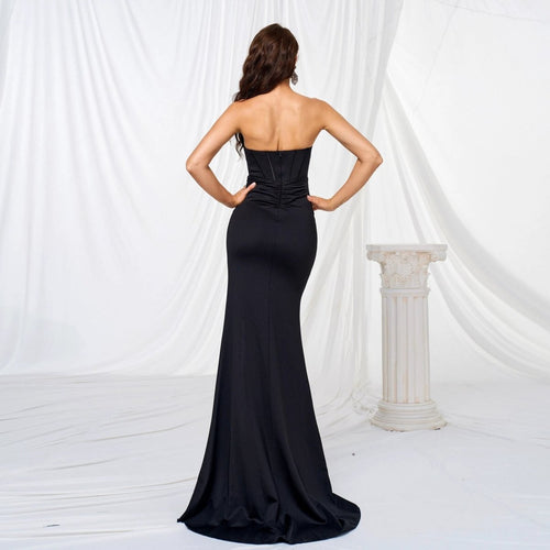Mandotos elegant black evening dress with off-shoulder neckline, chest wrap design, long length, and large hem for formal occasions.
