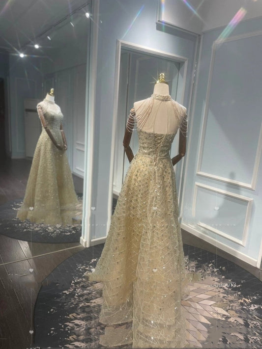 Mandotos luxury toast-colored evening dress with golden neck hanging light embellishments, elegant and stylish for special occasions.