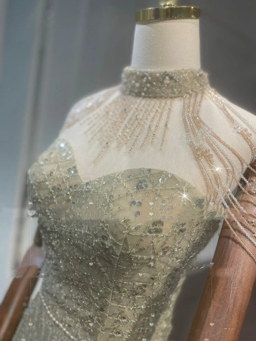 Mandotos golden neck hanging light luxury toast evening dress with elegant design and flowing fabric for formal occasions.