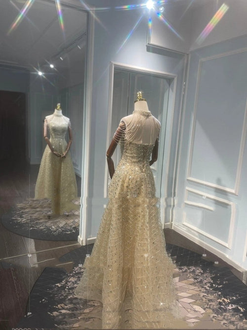 Mandotos luxury toast evening dress with a golden neck hanging light design, elegant for formal occasions.