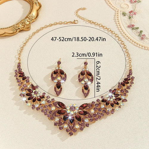Mandotos crystal necklace and earrings suite featuring high-profile, generous design with sparkling clear crystals for elegant style.