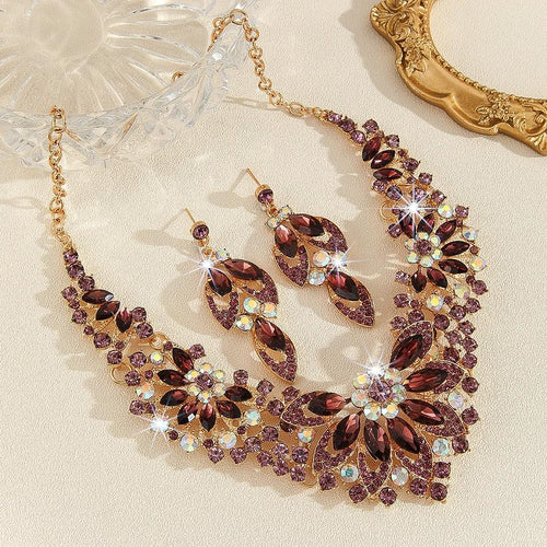 Mandotos high-profile crystal necklace and earrings suite featuring sparkling, elegant jewelry for formal occasions.