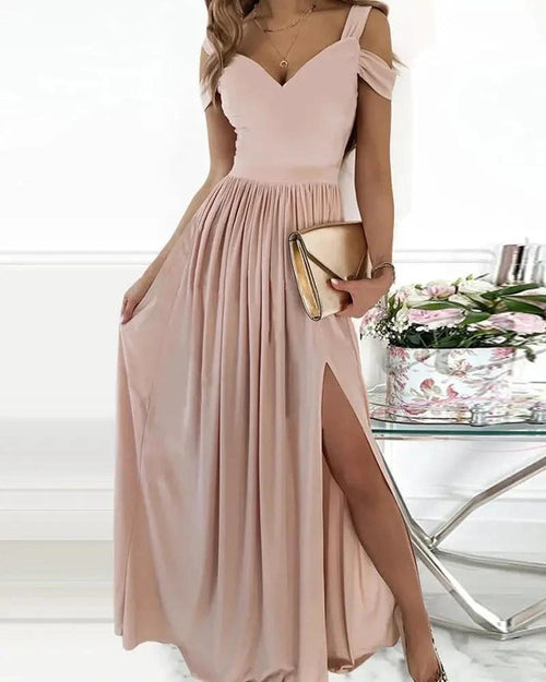 Elegant MANDOTOS Greek style long floor-length pleated dress displayed, showcasing flowing fabric and intricate pleats.